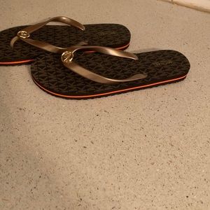 Never worn Michael Kors flip flops